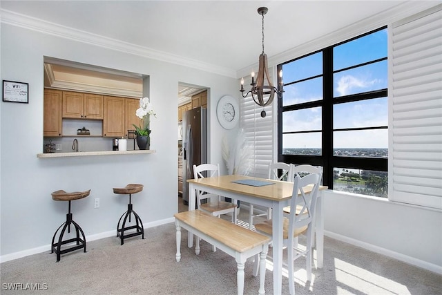 440 Seaview Ct Unit 1106, Marco Island, FL 34145 - dining space with a chandelier, ornamental molding, and light carpet