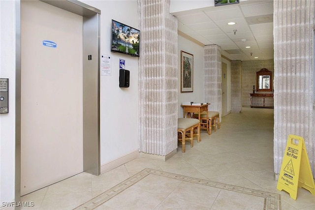 440 Seaview Ct Unit 1106, Marco Island, FL 34145 - hallway featuring elevator, light tile patterned floors, and recessed lighting
