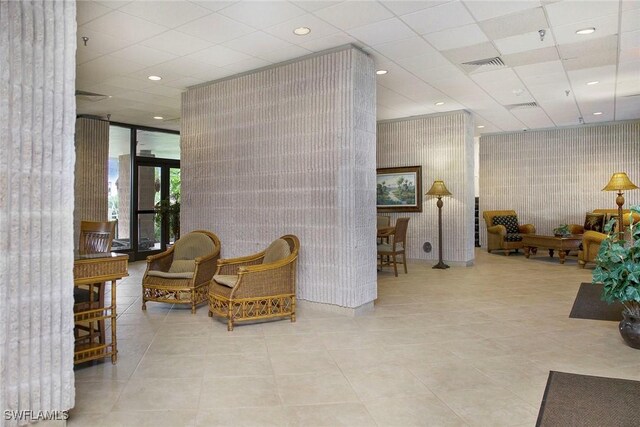 440 Seaview Ct Unit 1106, Marco Island, FL 34145 - lobby with wallpapered walls, recessed lighting, and a drop ceiling