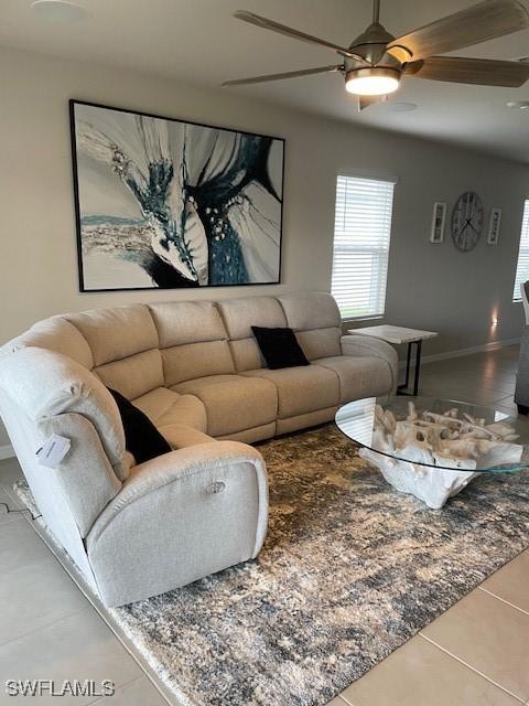 18521 Cronin Sand Ln, North Fort Myers, FL 33917 - tiled living area featuring ceiling fan and plenty of natural light