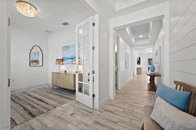 3640 Pilot Cir, Naples, FL 34120 - corridor featuring light wood-style floors, a tray ceiling, and recessed lighting