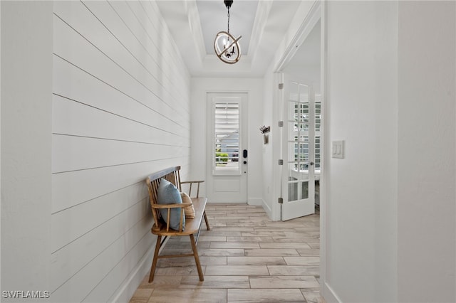 3640 Pilot Cir, Naples, FL 34120 - entryway featuring light wood finished floors, a chandelier, and a tray ceiling