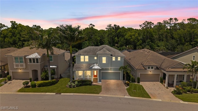 3640 Pilot Cir, Naples, FL 34120 - traditional home with driveway, stucco siding, and a garage