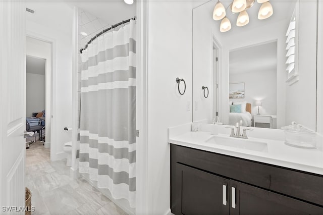 3640 Pilot Cir, Naples, FL 34120 - full bath with vanity, marble finish floors, ensuite bath, and a shower with shower curtain