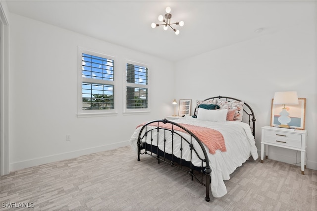3640 Pilot Cir, Naples, FL 34120 - carpeted bedroom with a chandelier and baseboards