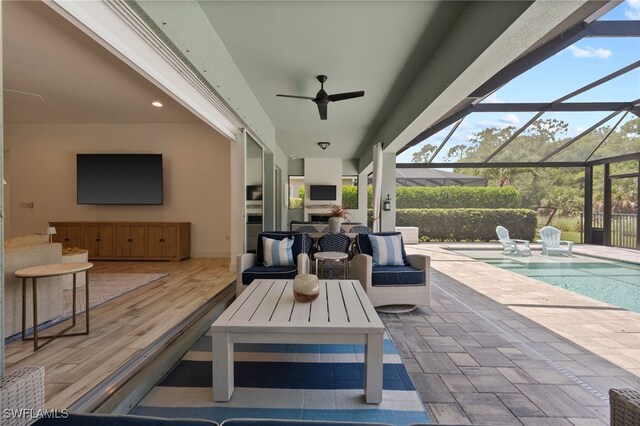 3640 Pilot Cir, Naples, FL 34120 - view of patio with an outdoor pool, glass enclosure, and a ceiling fan