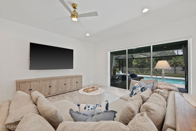 3640 Pilot Cir, Naples, FL 34120 - living room with a sunroom, a ceiling fan, wood finished floors, and recessed lighting
