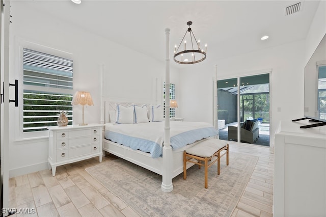 3640 Pilot Cir, Naples, FL 34120 - bedroom featuring access to exterior, a chandelier, recessed lighting, and light wood finished floors