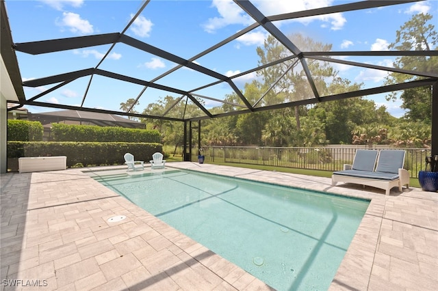 3640 Pilot Cir, Naples, FL 34120 - outdoor pool featuring a patio and glass enclosure