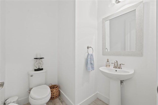 3640 Pilot Cir, Naples, FL 34120 - bathroom featuring toilet and baseboards