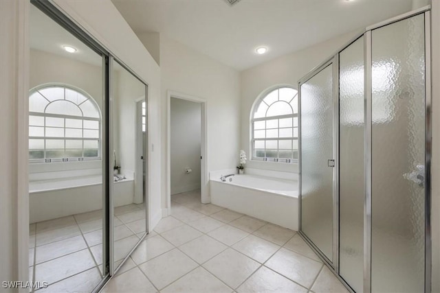 1087 Port Orange Way, Naples, FL 34120 - bathroom with a bath, a shower stall, tile patterned flooring, and recessed lighting