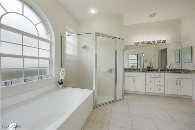 1087 Port Orange Way, Naples, FL 34120 - full bathroom with a stall shower, double vanity, a bath, and tile patterned flooring