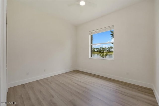 1087 Port Orange Way, Naples, FL 34120 - unfurnished room featuring wood finished floors and ceiling fan