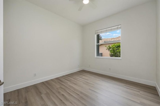 1087 Port Orange Way, Naples, FL 34120 - empty room with a ceiling fan and wood finished floors