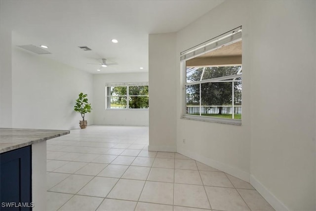 1087 Port Orange Way, Naples, FL 34120 - spare room featuring light tile patterned flooring, recessed lighting, and a ceiling fan