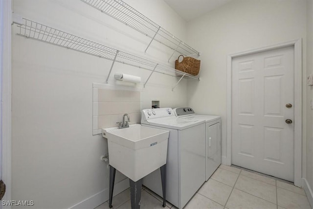 1087 Port Orange Way, Naples, FL 34120 - laundry room featuring separate washer and dryer and light tile patterned floors