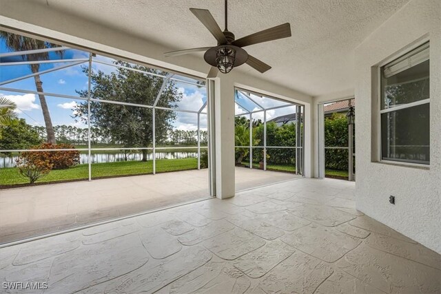 1087 Port Orange Way, Naples, FL 34120 - unfurnished sunroom with a water view and ceiling fan