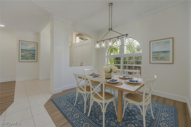 1087 Port Orange Way, Naples, FL 34120 - tiled dining room featuring ornamental molding