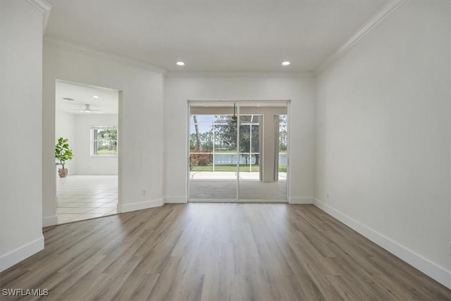 1087 Port Orange Way, Naples, FL 34120 - spare room with crown molding, wood finished floors, recessed lighting, and ceiling fan