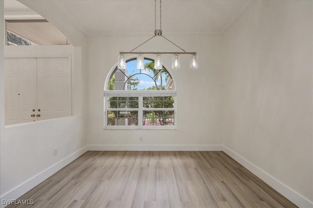 1087 Port Orange Way, Naples, FL 34120 - unfurnished dining area with wood finished floors and crown molding