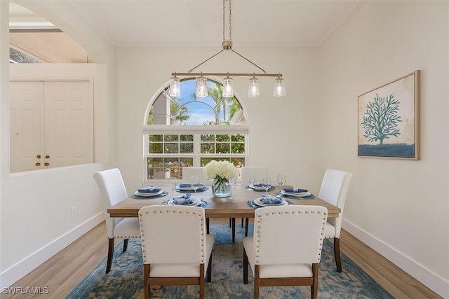 1087 Port Orange Way, Naples, FL 34120 - dining room featuring wood finished floors and crown molding