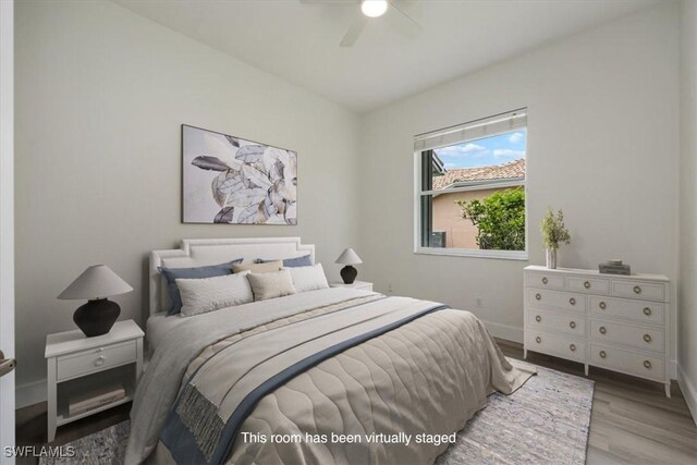 1087 Port Orange Way, Naples, FL 34120 - bedroom featuring wood finished floors and ceiling fan