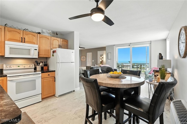 5600 Bonita Beach Rd Unit 4-605, Bonita Springs, FL 34134 - kitchen with white appliances, dark countertops, ceiling fan, and light marble finish flooring