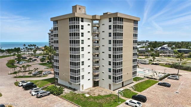 5600 Bonita Beach Rd Unit 4-605, Bonita Springs, FL 34134 - view of apartment building / complex with uncovered parking and a water view