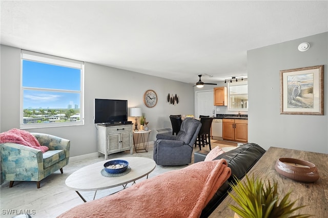 5600 Bonita Beach Rd Unit 4-605, Bonita Springs, FL 34134 - living room featuring a ceiling fan and baseboards