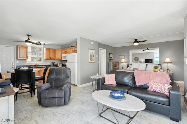 5600 Bonita Beach Rd Unit 4-605, Bonita Springs, FL 34134 - living room with a ceiling fan, plenty of natural light, and light marble finish floors