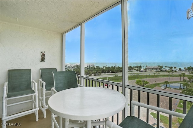 5600 Bonita Beach Rd Unit 4-605, Bonita Springs, FL 34134 - sunroom / solarium with healthy amount of natural light and a water view