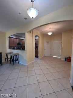 4400 Lazio Way Unit 201, Fort Myers, FL 33901 - unfurnished room with arched walkways and tile patterned floors