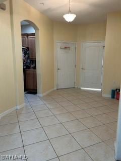 4400 Lazio Way Unit 201, Fort Myers, FL 33901 - entryway with arched walkways and light tile patterned floors