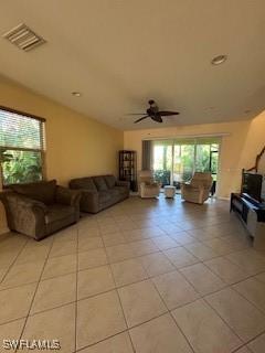 4400 Lazio Way Unit 201, Fort Myers, FL 33901 - living area with ceiling fan and light tile patterned floors