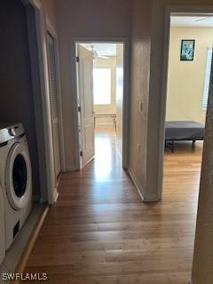 4400 Lazio Way Unit 201, Fort Myers, FL 33901 - laundry room featuring washer / clothes dryer and wood finished floors