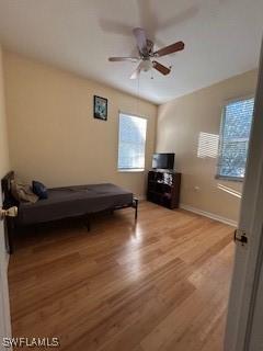 4400 Lazio Way Unit 201, Fort Myers, FL 33901 - bedroom featuring light wood-style flooring and a ceiling fan