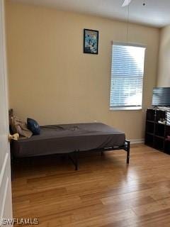 4400 Lazio Way Unit 201, Fort Myers, FL 33901 - bedroom featuring light wood-type flooring and a ceiling fan