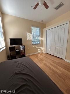 4400 Lazio Way Unit 201, Fort Myers, FL 33901 - bedroom with wood finished floors, a closet, and ceiling fan