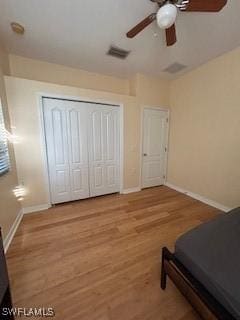 4400 Lazio Way Unit 201, Fort Myers, FL 33901 - bedroom with wood finished floors, a closet, and ceiling fan