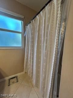 4400 Lazio Way Unit 201, Fort Myers, FL 33901 - full bathroom featuring tile patterned flooring and a shower with shower curtain