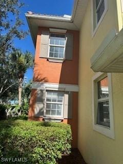 4400 Lazio Way Unit 201, Fort Myers, FL 33901 - view of property exterior with stucco siding