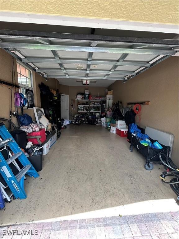4400 Lazio Way Unit 201, Fort Myers, FL 33901 - garage with a garage door opener