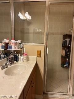 4400 Lazio Way Unit 201, Fort Myers, FL 33901 - full bathroom featuring vanity, a stall shower, and tile patterned floors