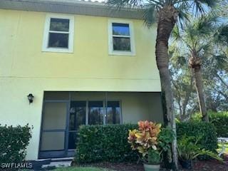 4400 Lazio Way Unit 201, Fort Myers, FL 33901 - rear view of house with stucco siding