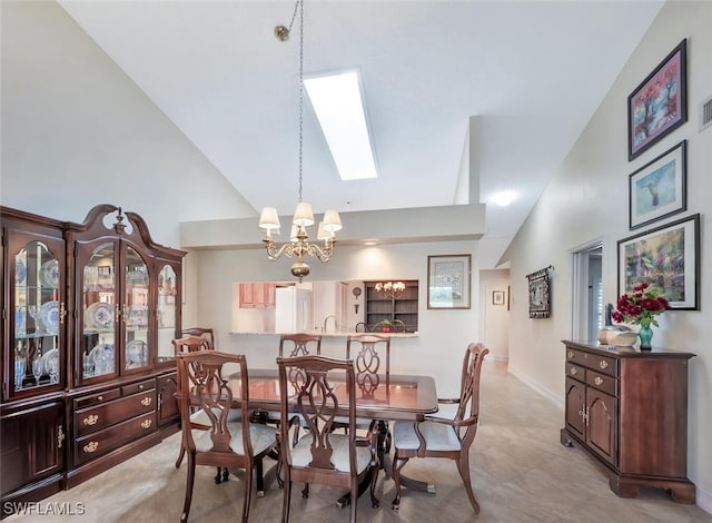 866 Marblehead Dr Unit H6, Naples, FL 34104 - dining area featuring a chandelier, a skylight, and high vaulted ceiling