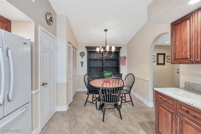 866 Marblehead Dr Unit H6, Naples, FL 34104 - dining room with arched walkways and a chandelier