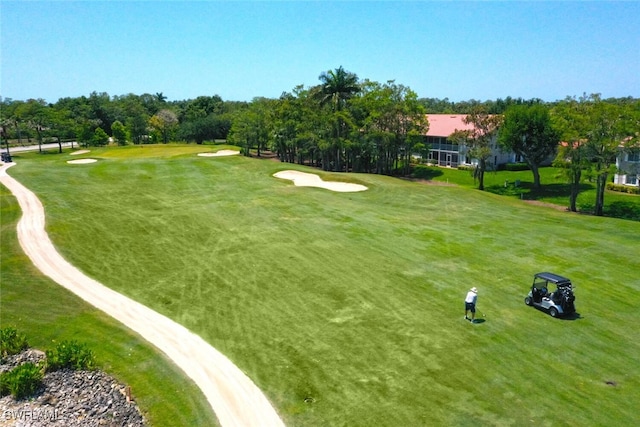866 Marblehead Dr Unit H6, Naples, FL 34104 - surrounding community featuring golf course view, view of scattered trees, and a lawn