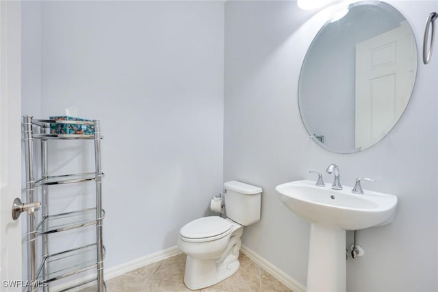 11758 Izarra Way Unit 7703, Fort Myers, FL 33912 - bathroom with toilet and tile patterned flooring