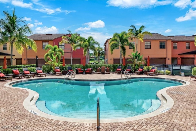 11758 Izarra Way Unit 7703, Fort Myers, FL 33912 - community pool featuring a patio area