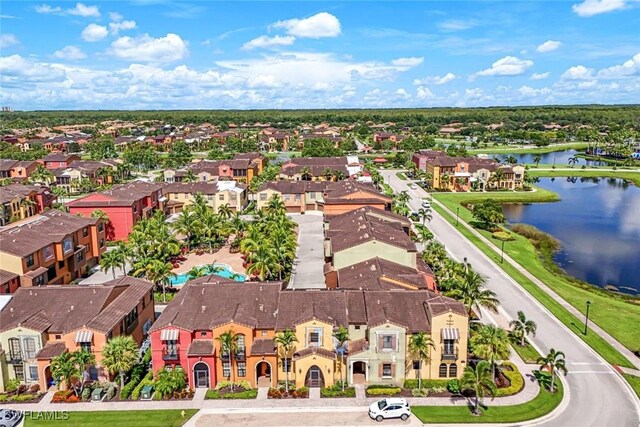 11758 Izarra Way Unit 7703, Fort Myers, FL 33912 - aerial perspective of suburban area with a nearby body of water